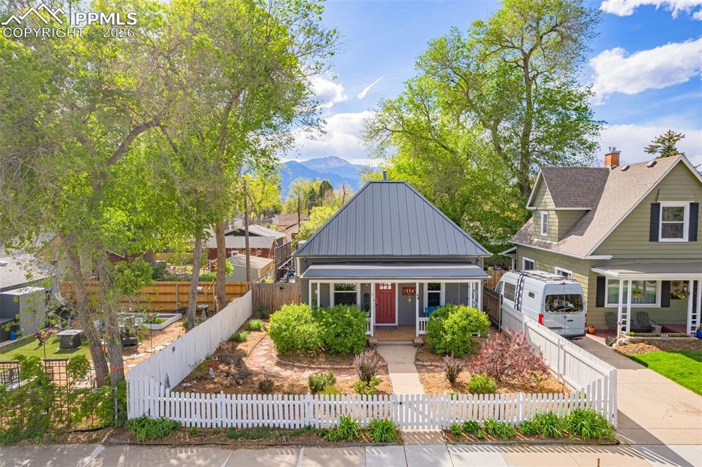 Image 37 of 41: That red door says it all—welcome home