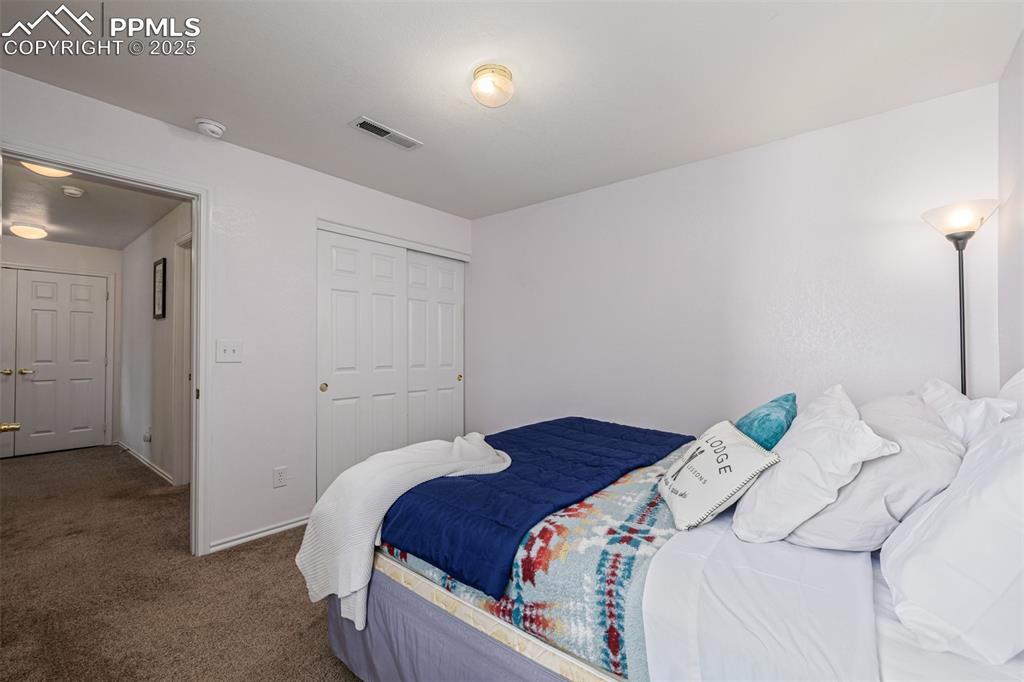 Image 12 of 22: Bedroom featuring carpet floors and spacious closet