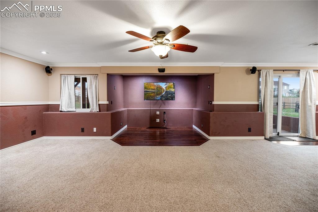 Image 29 of 46: Spare room with healthy amount of natural light, carpet floors, crown moldi