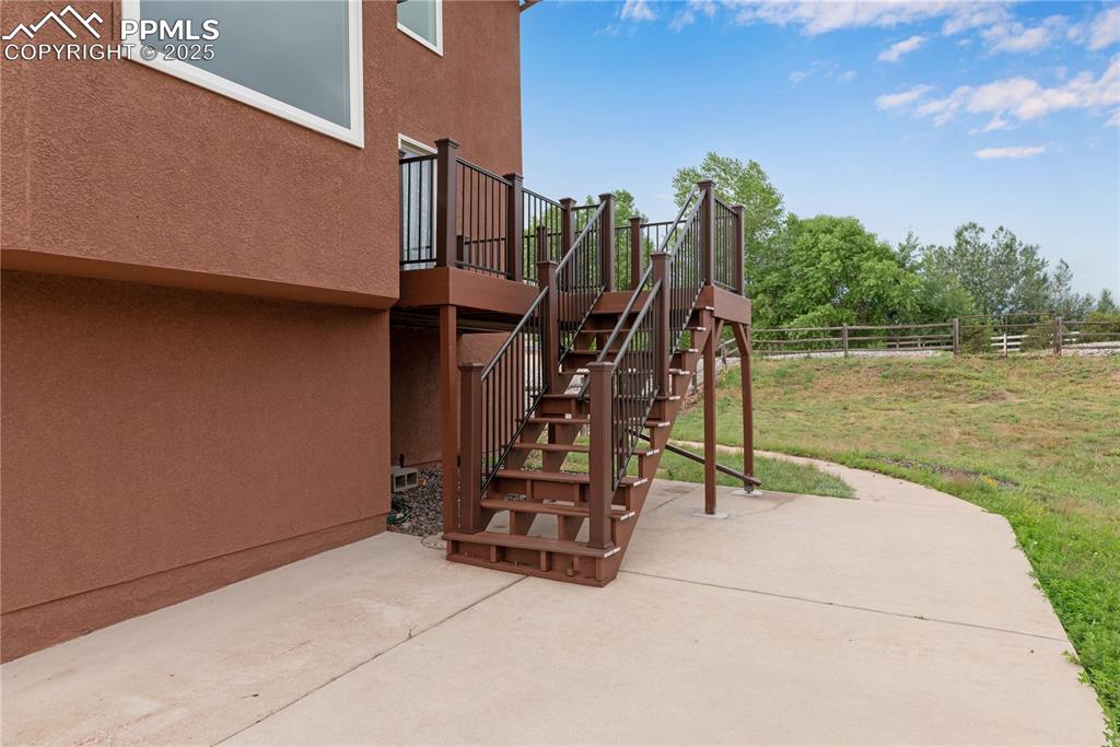 Image 4 of 46: View of patio / terrace with stairs and a wooden deck