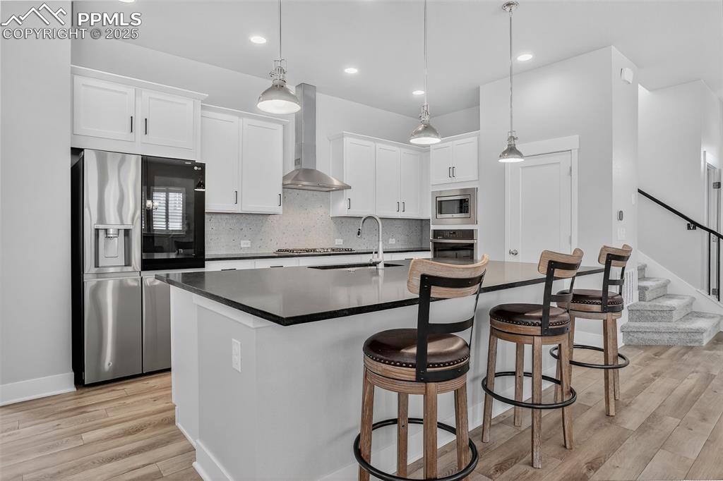 Image 10 of 50: Appointed with upgraded stainless steel appliances and fixtures. Large pant
