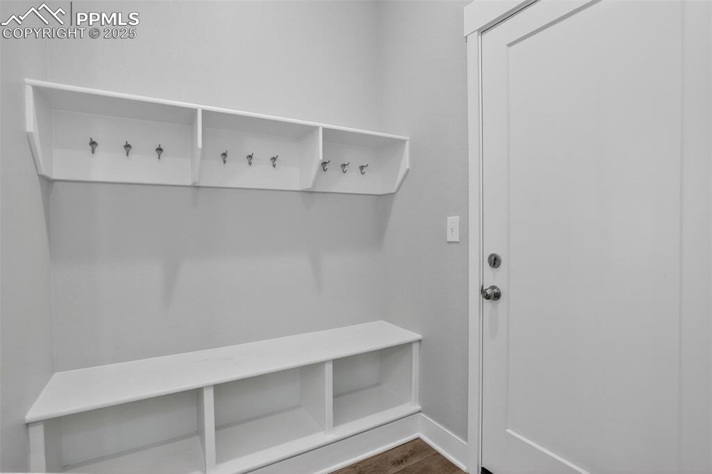 Image 20 of 50: Mud Room with a coat closet is organize and efficient.
