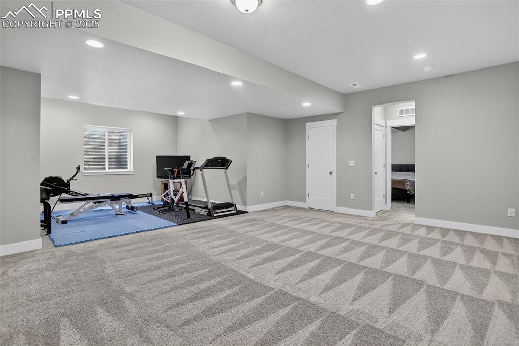 Image 33 of 50: Large fully finished basement with plenty of space for lots of seating, gam