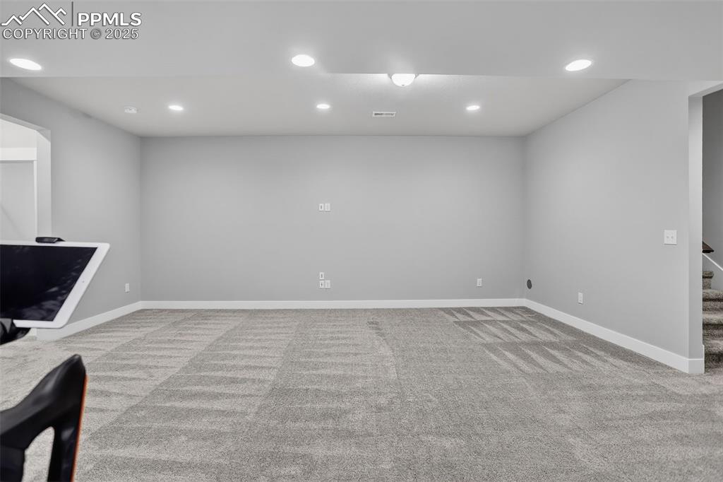 Image 36 of 50: Basement Family Room - limitless possibilities!