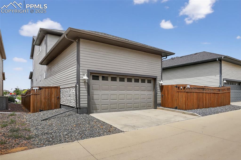 Image 47 of 50: 2 Car garage with door opener