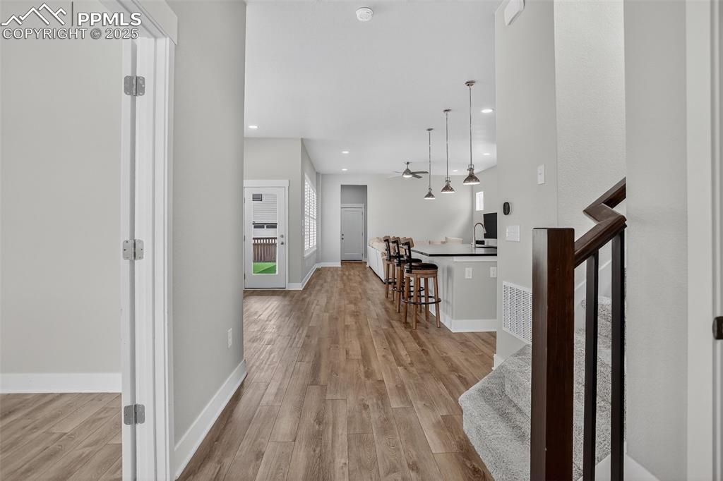 Image 5 of 50: As you enter, to the left, note the bright office through french doors with