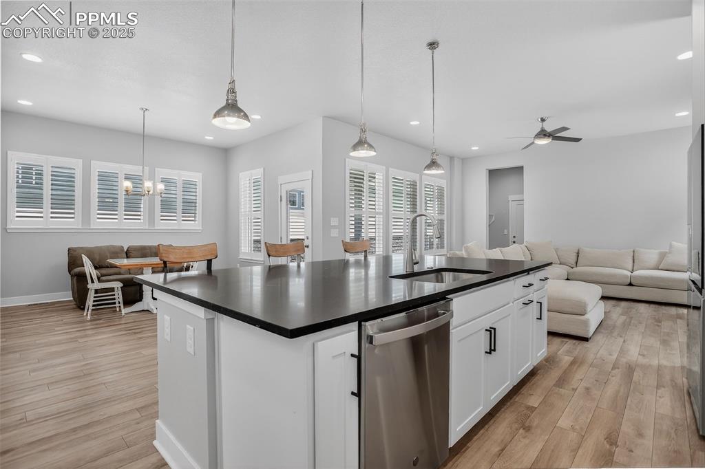 Image 9 of 50: Beautifully upgraded kitchen with large island, breakfast bar seating and u