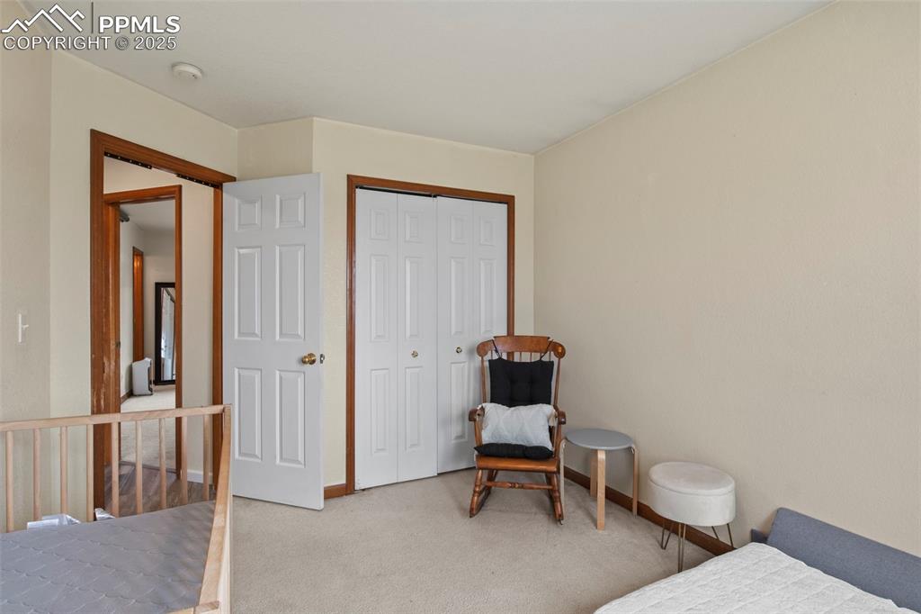 Image 25 of 35: Carpeted bedroom featuring a closet and baseboards