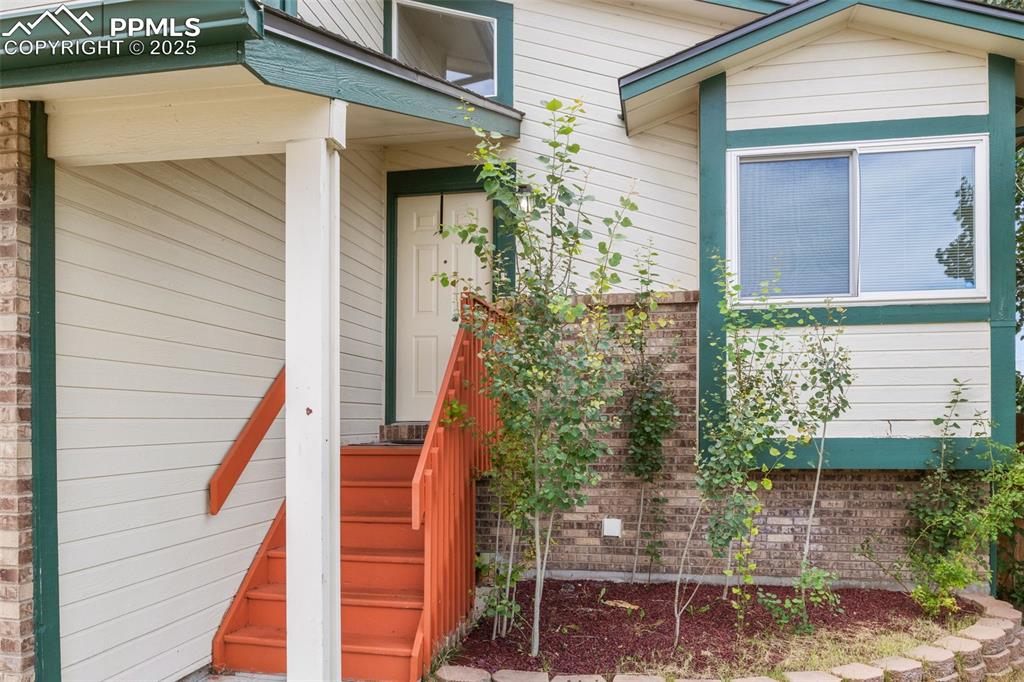 Image 5 of 35: Entrance to property featuring brick siding