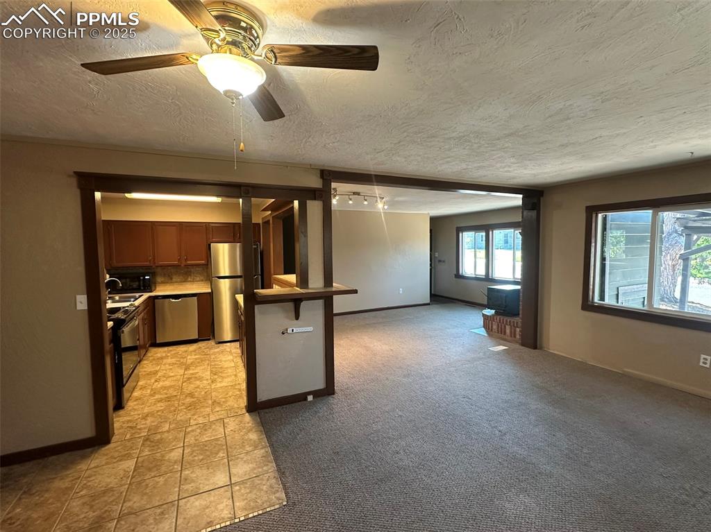 Image 11 of 27: Open living / dining / kitchen floorplan