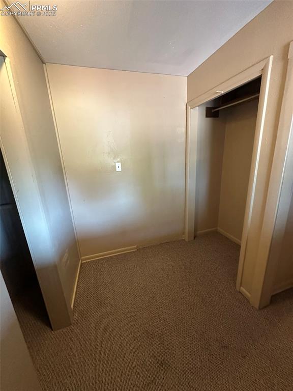 Image 16 of 27: View of seating area and master closets