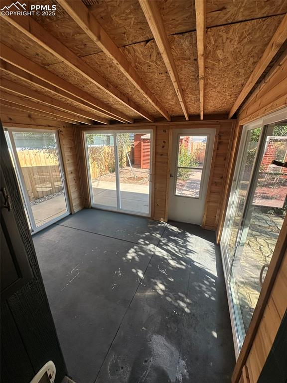 Image 19 of 27: View of workshop / sunroom in the rear of house