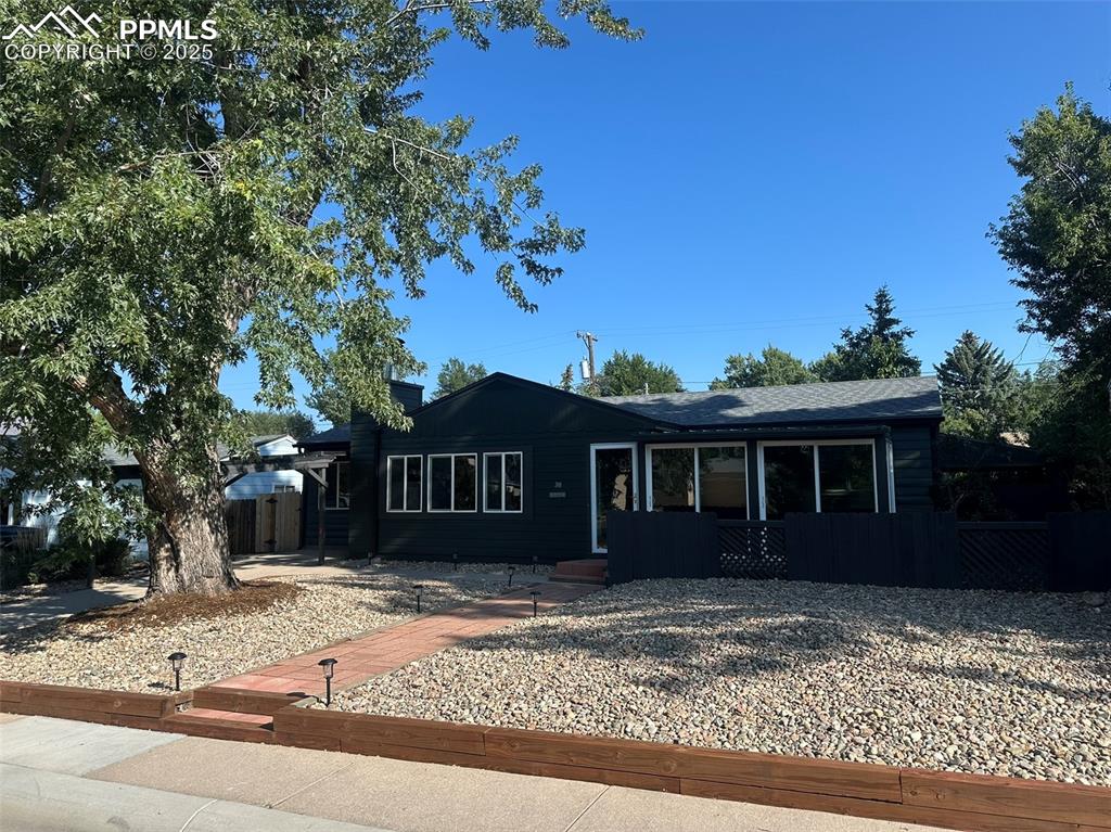 Image 2 of 27: Ranch style home with board and batten siding