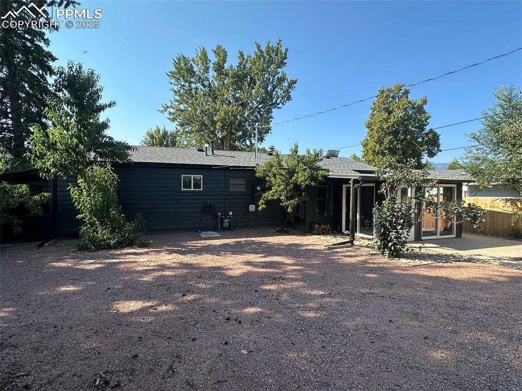 Image 21 of 27: Rear view of property with a patio area and a new comp shingle roof