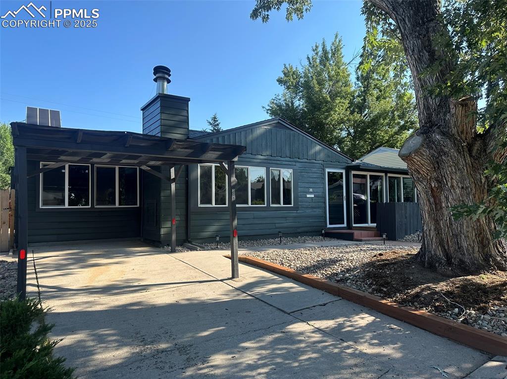 Image 3 of 27: Driveway and carport