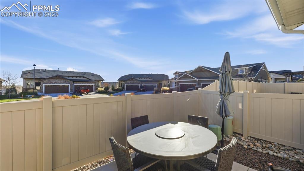 Image 14 of 42: Private patio located off the Kitchen for outdoor dining and relaxation.