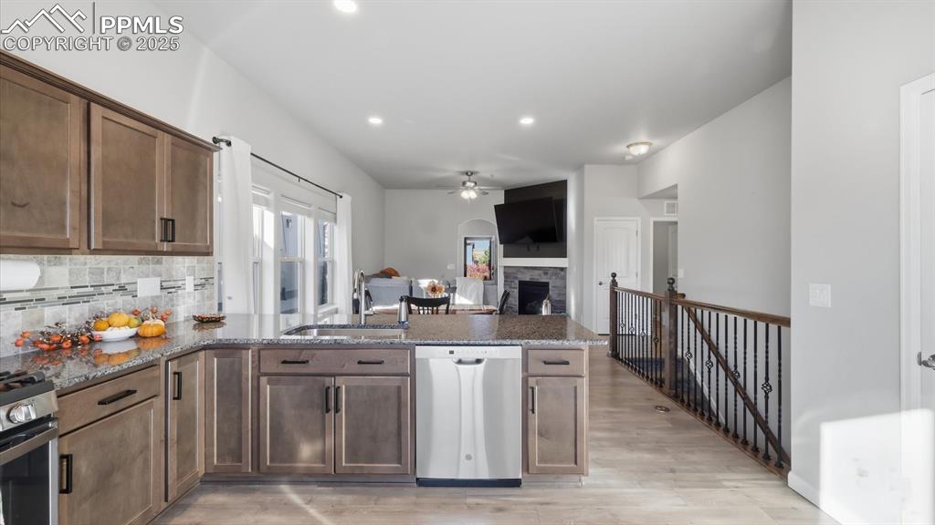 Image 19 of 42: View of the Dining Area and Living Room from the Kitchen.