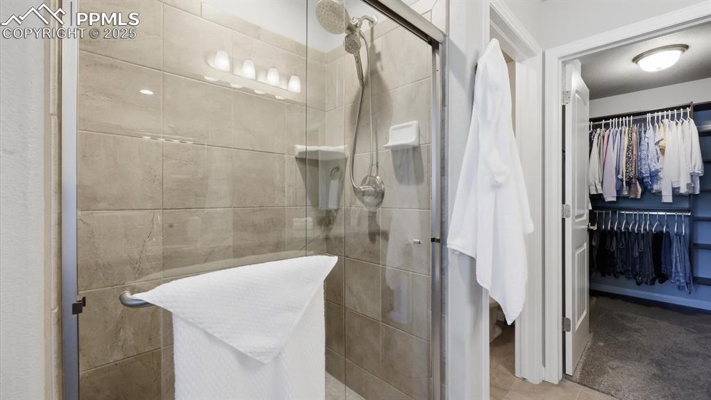 Image 23 of 42: Oversized tiled shower in Primary Bathroom.
