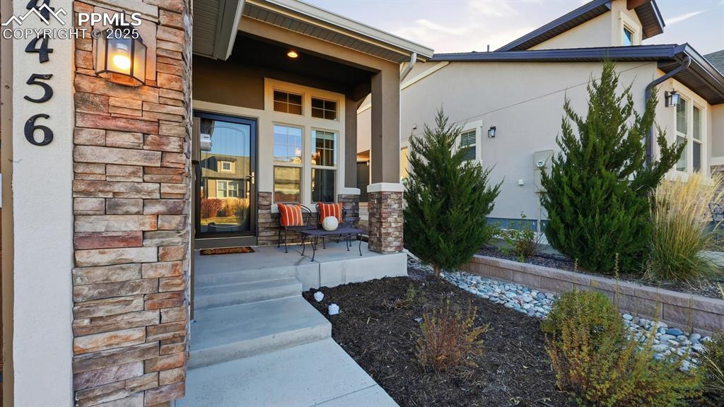 Image 6 of 42: Covered front porch to enjoy your morning coffee and the Colorado sunshine.