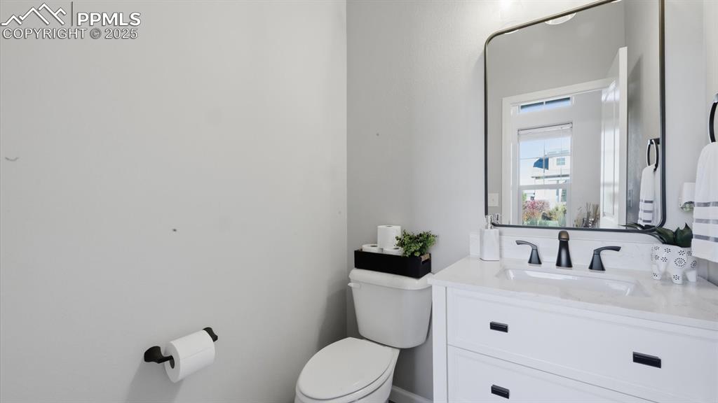 Image 8 of 42: Convenient Powder Bathroom for guests.