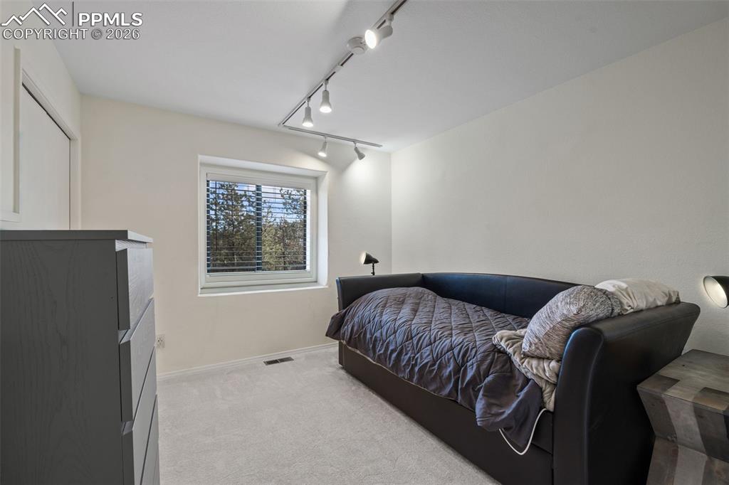 Image 21 of 47: Secondary carpeted bedroom