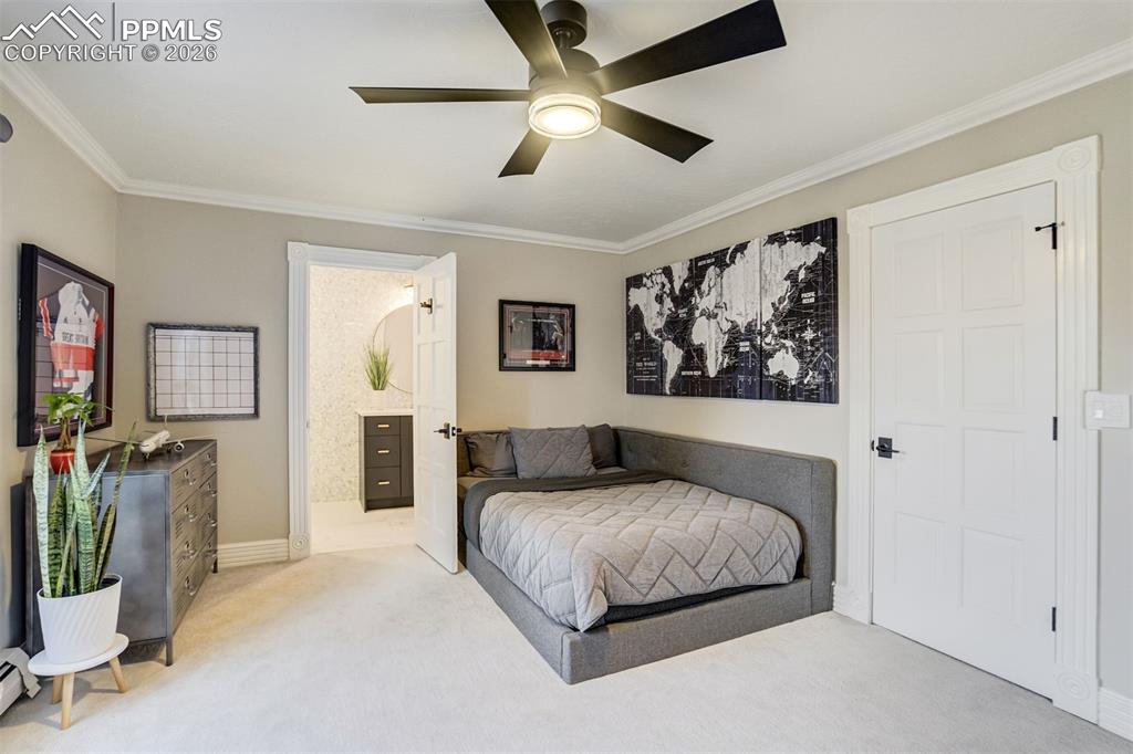 Image 32 of 50: Upper level bedroom with ensuite bath and walk in closet