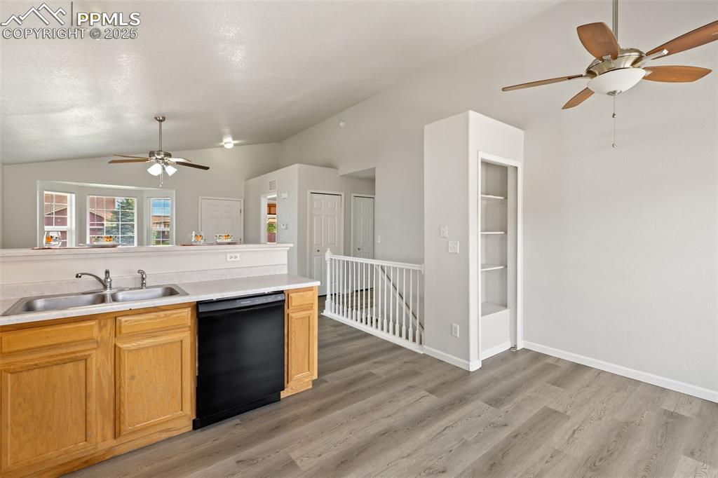 Image 13 of 34: Kitchen open to the living room