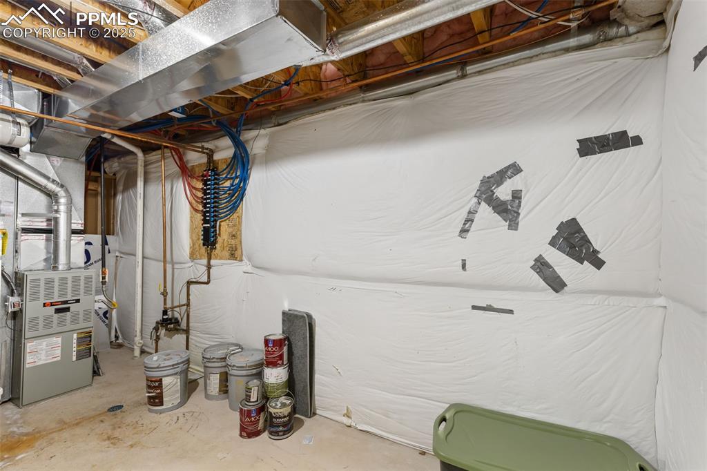 Image 29 of 34: Furnace room/storage area