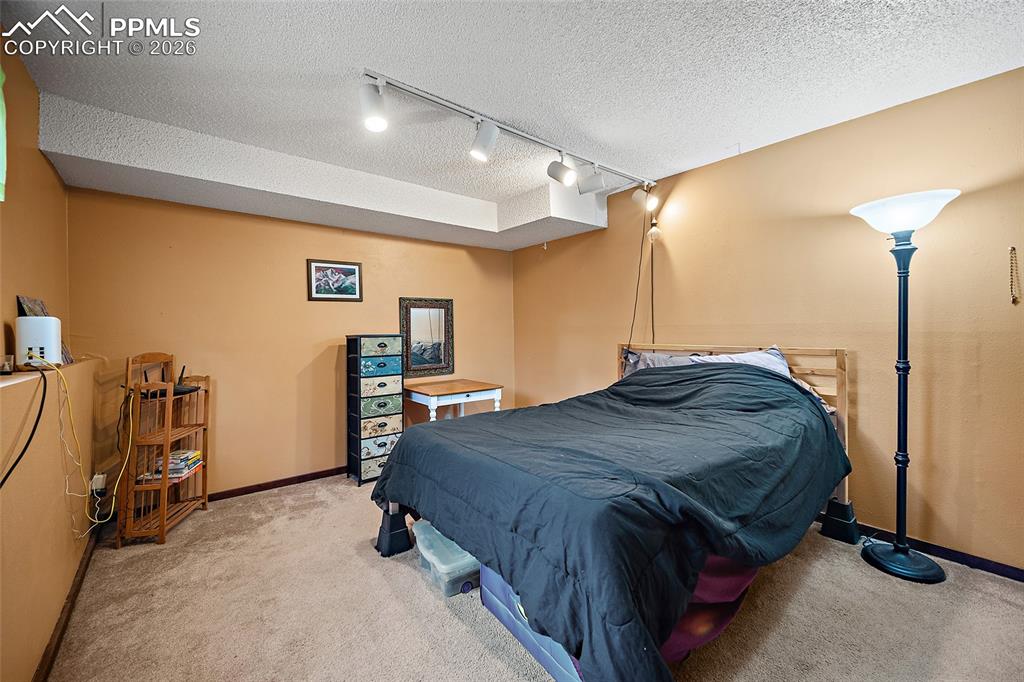 Image 20 of 32: Lower floor bedroom.