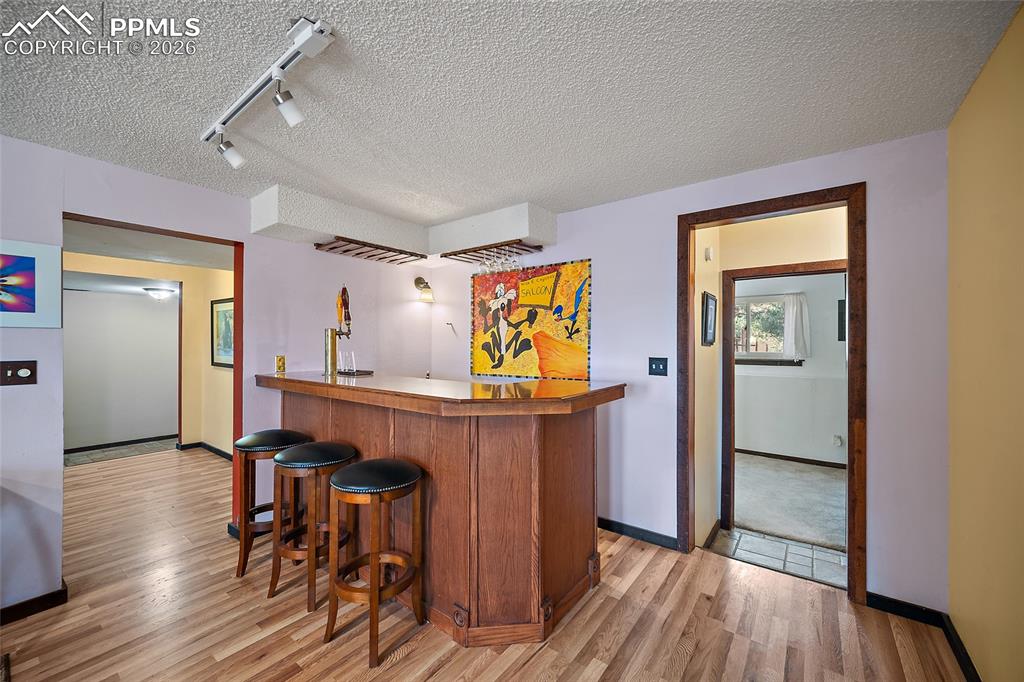 Image 23 of 32: Bar & wet bar with built in kegerator system.