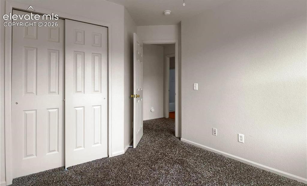 Image 11 of 24: When vacant bedroom 2 facing closet and hallway