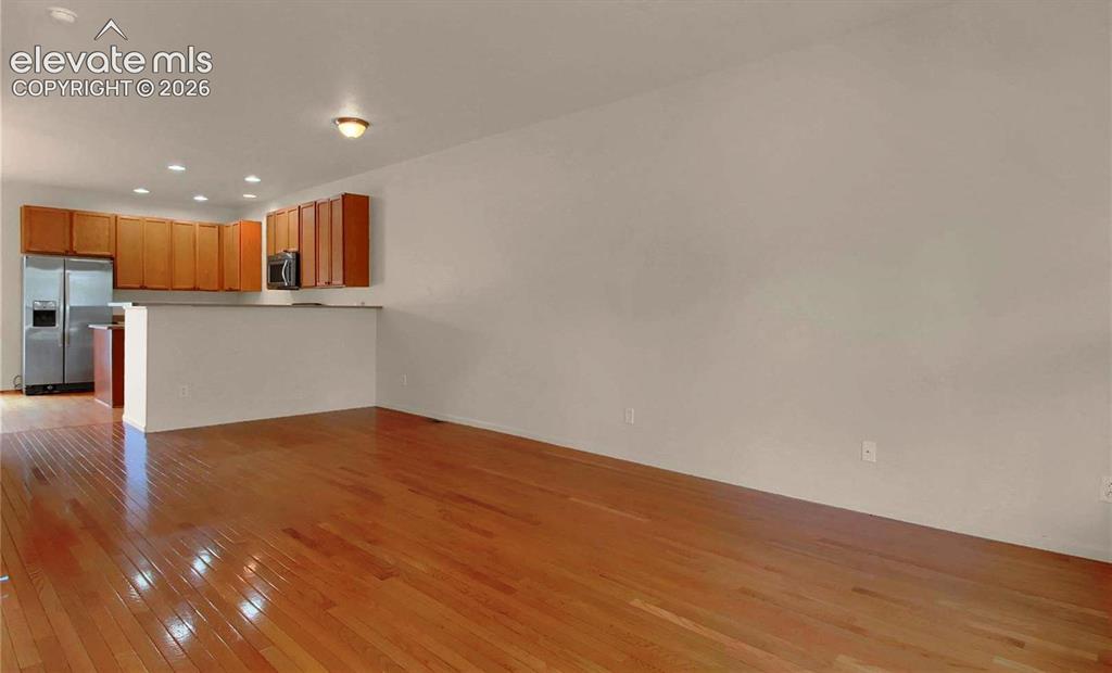 Image 2 of 24: When vacant Entrance facing kitchen.