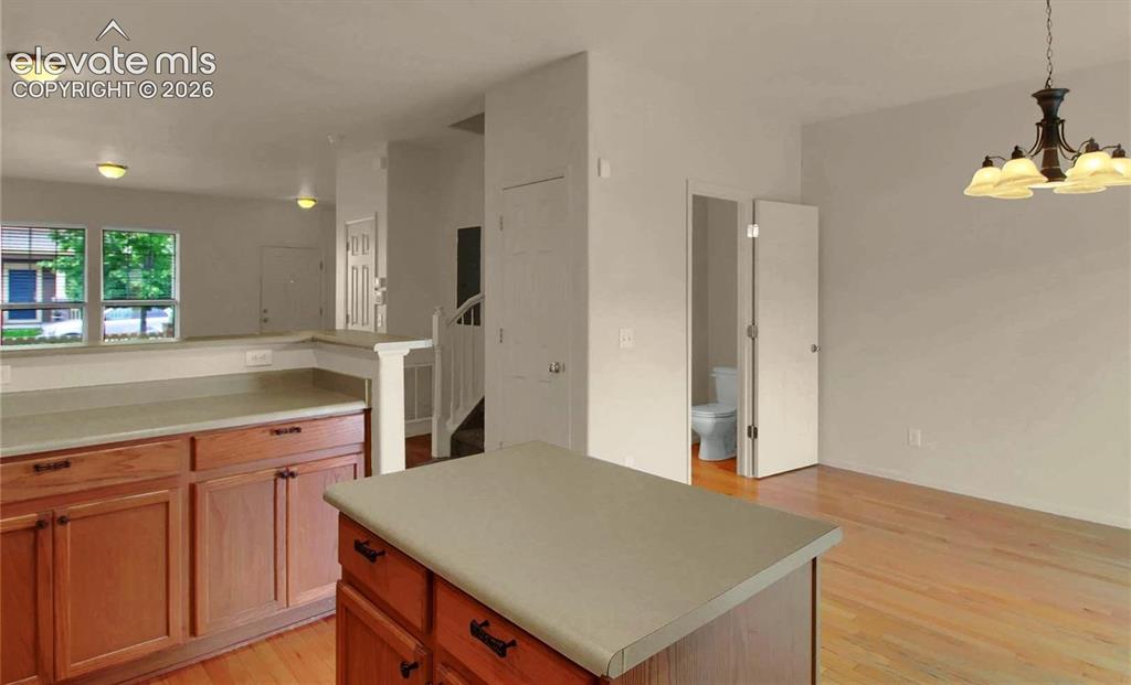 Image 5 of 24: When Vacant kitchen facing dining are and half bath