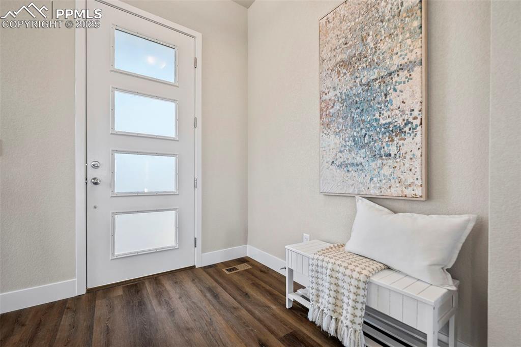 Image 5 of 41: Front entry with space for a bench!