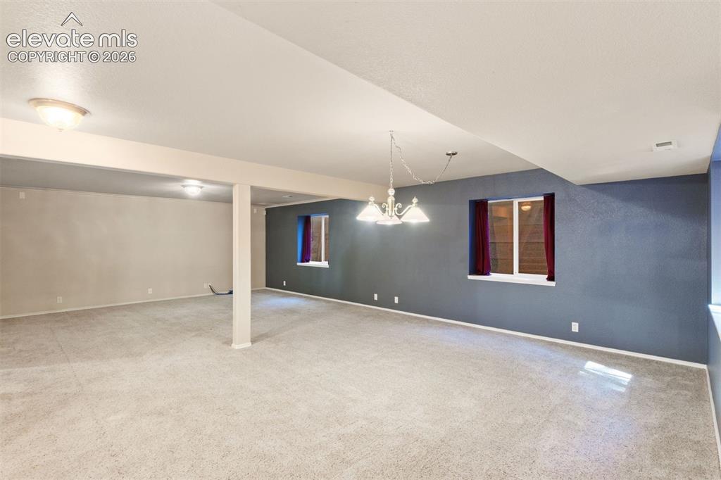 Image 34 of 50: Basement family room, great for entertaining!