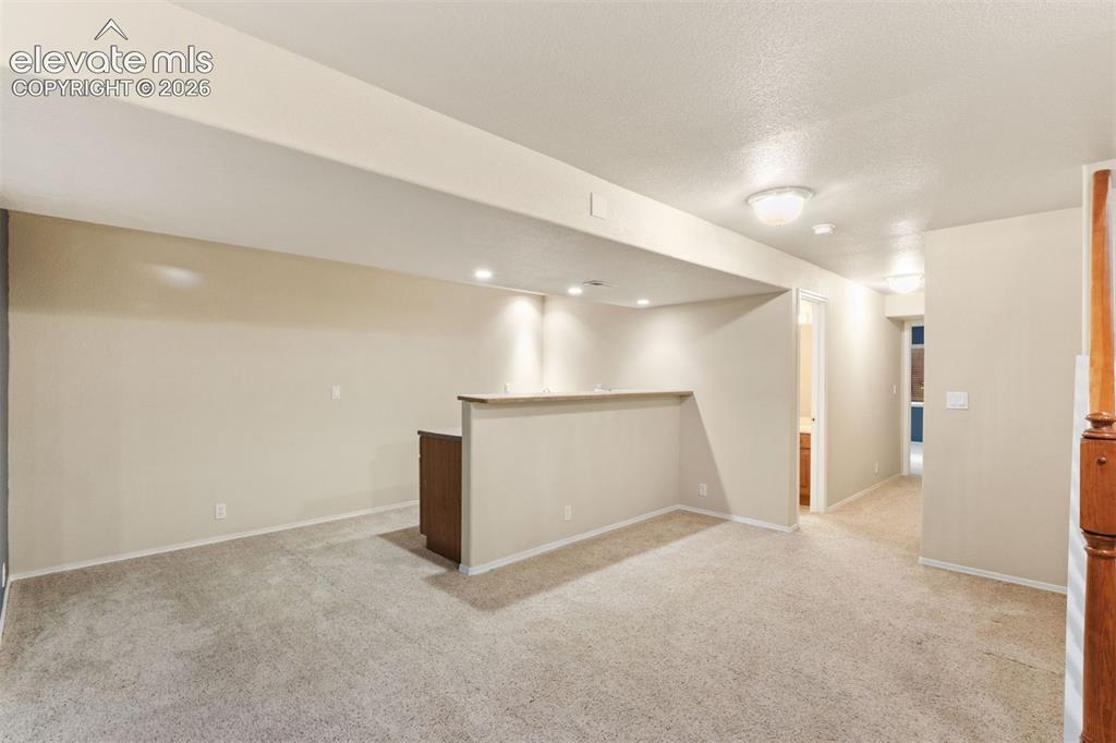 Image 36 of 50: Basement wet bar