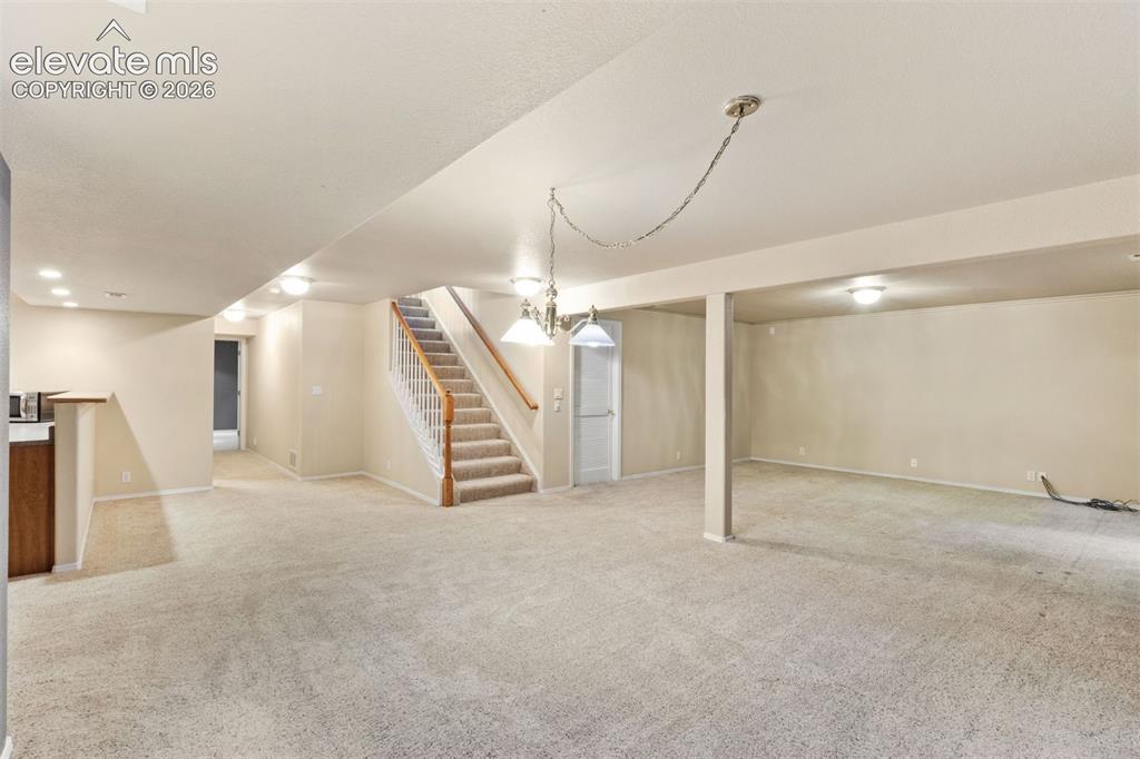 Image 37 of 50: Basement family room, great for entertaining!