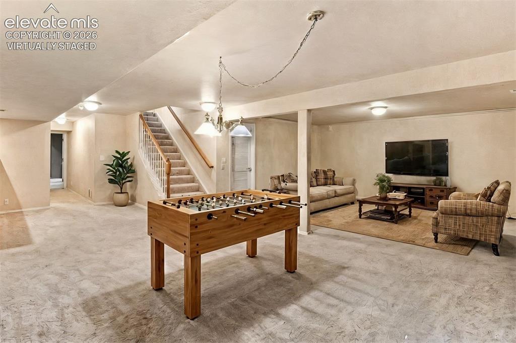 Image 38 of 50: virtually staged* Basement family room, great for entertaining!