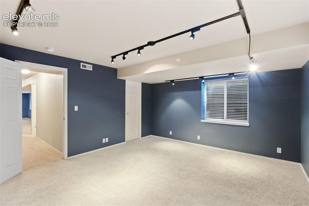 Image 40 of 50: Basement bedroom