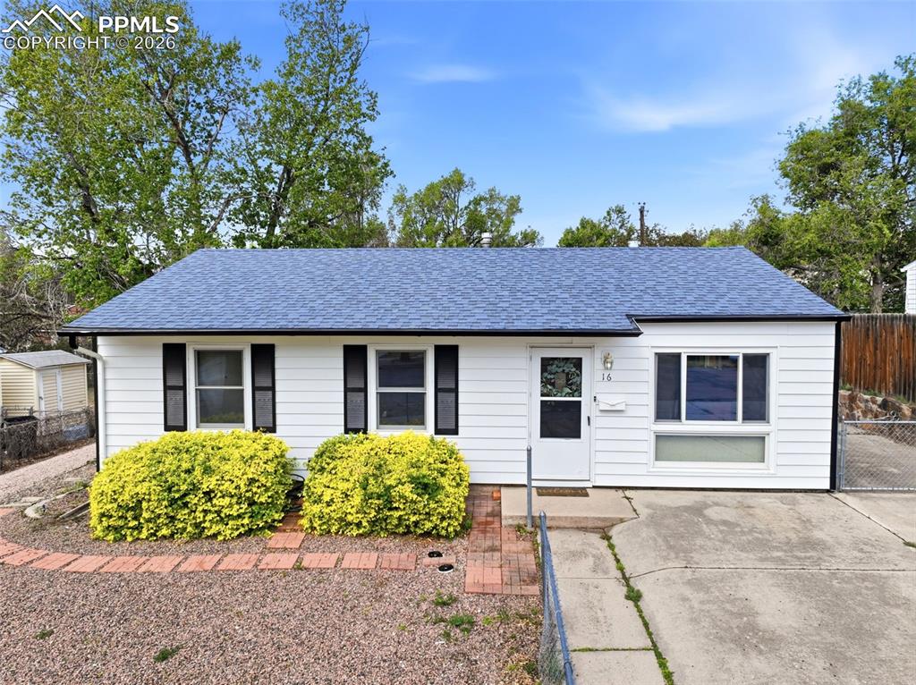 Image 1 of 38: Exterior features white siding, dark window shutters, and a blue shingle ro