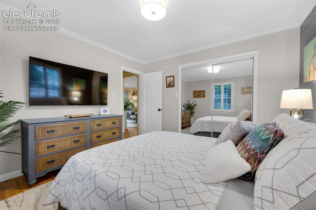 Image 16 of 50: Main bedroom with mirrored walk in closet