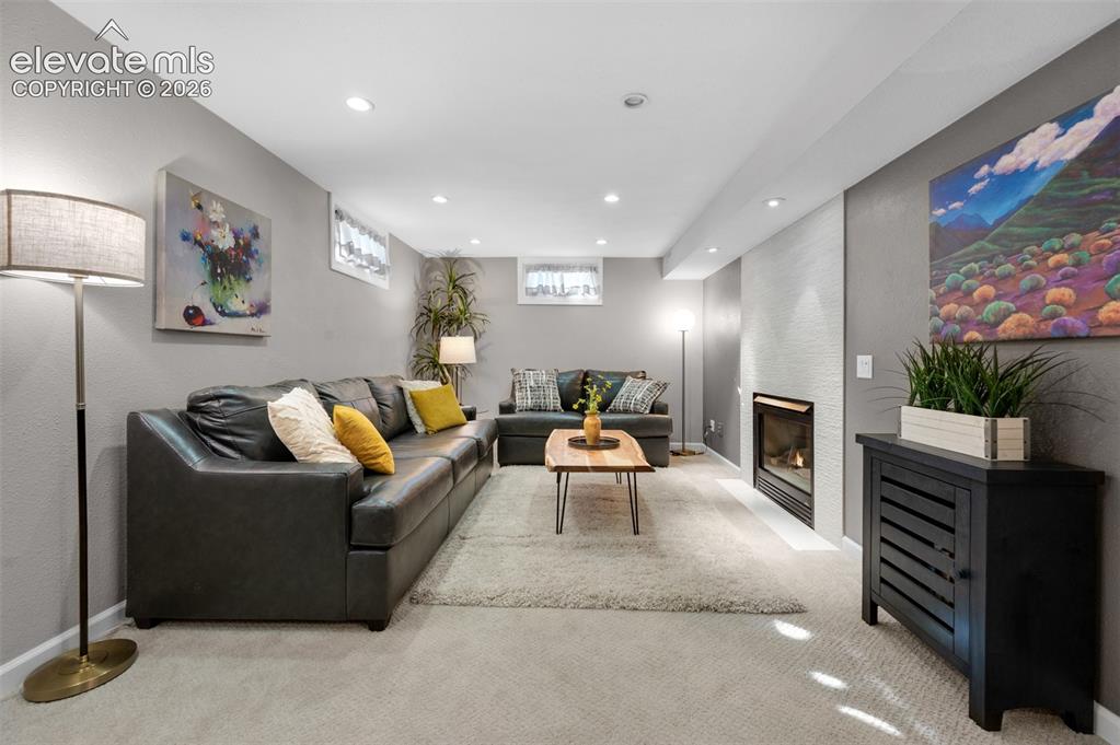 Image 21 of 50: Family room with gas fireplace