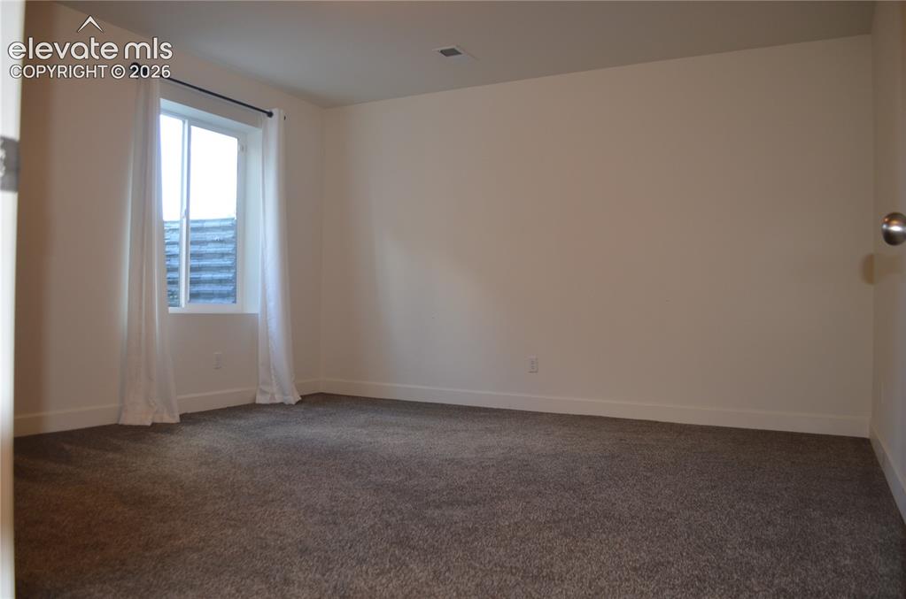 Image 17 of 30: Additional bedroom located in the basement