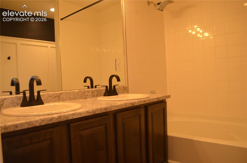 Image 26 of 30: Upper level hall bathroom