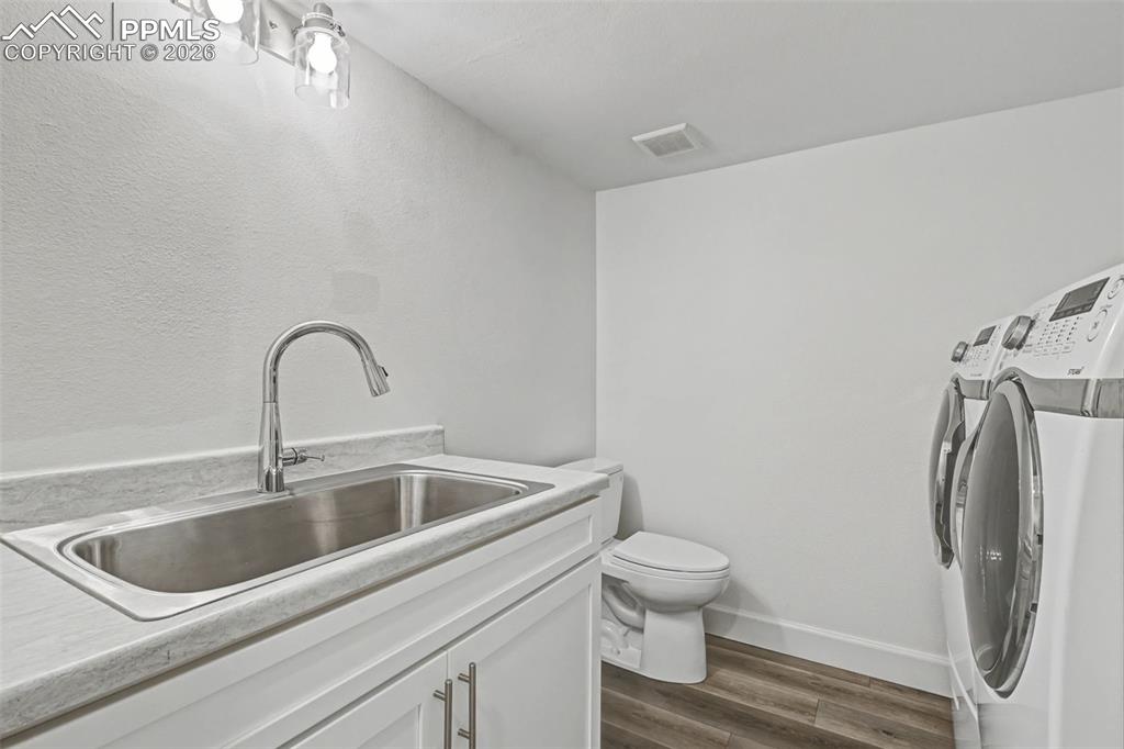 Image 43 of 49: Basement Laundry room