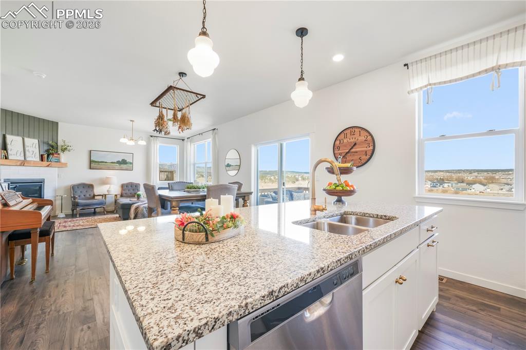 Image 11 of 50: Kitchen with gas range, stainless appliances, walk in pantry, granite count