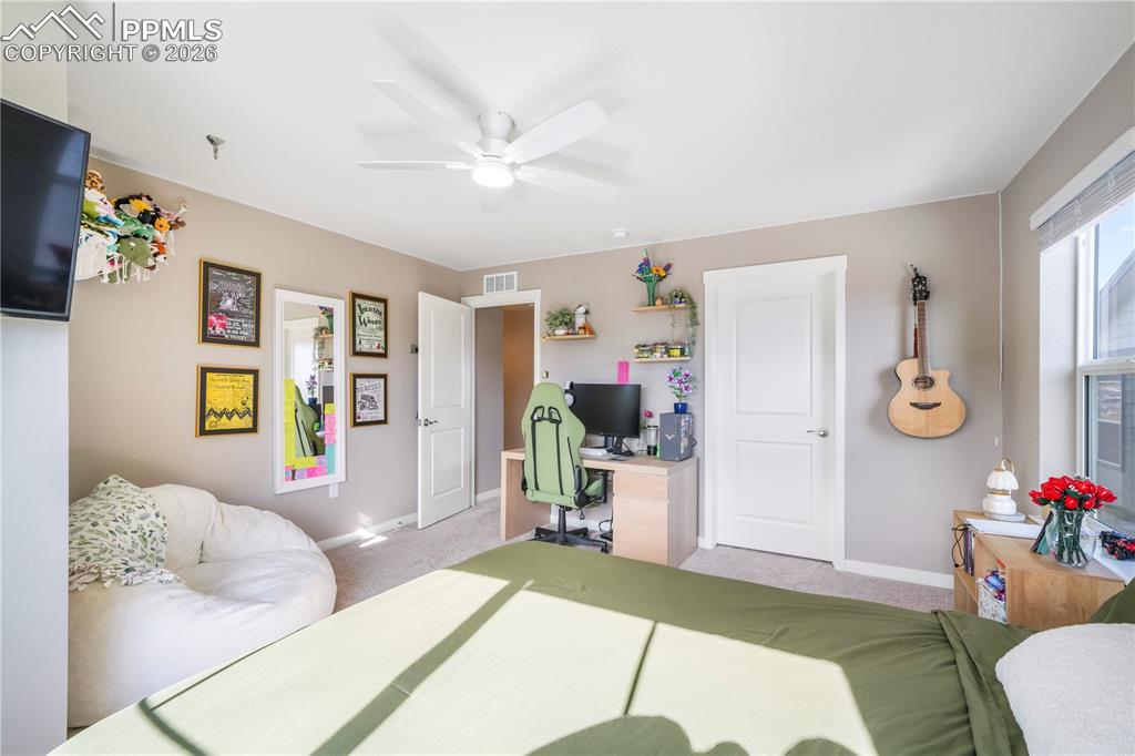 Image 36 of 50: Upstairs 4th bedroom with walk in closet and views