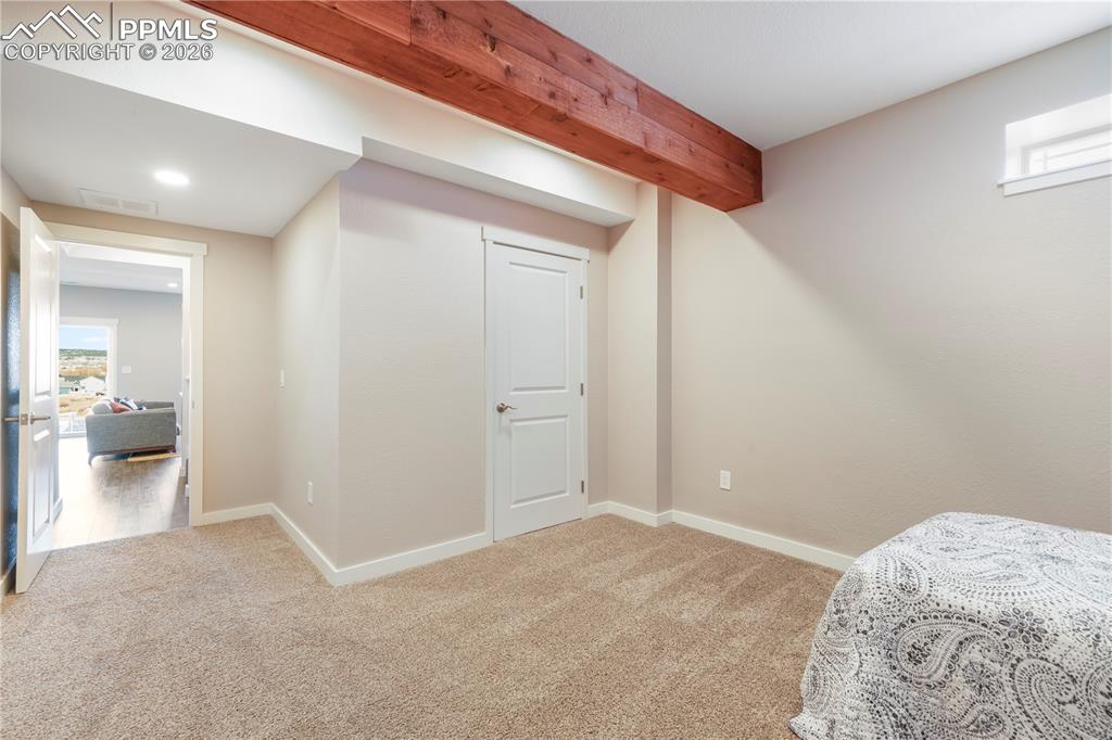 Image 44 of 50: Basement level flex room - great for guests, workout room, media room, ect