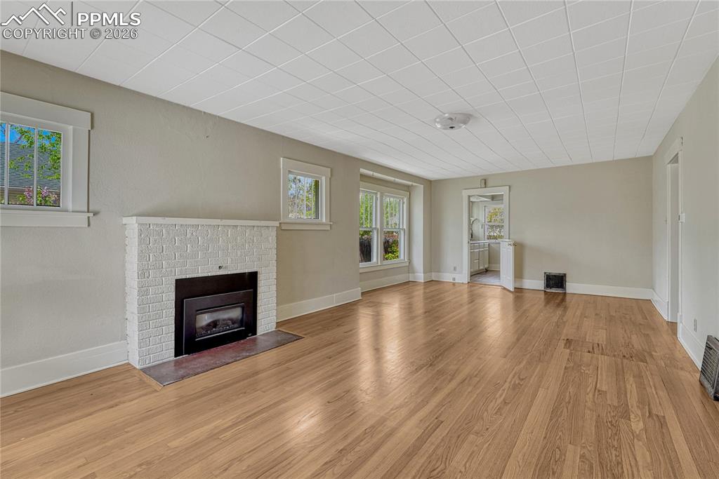Image 6 of 38: Living Room with fireplace