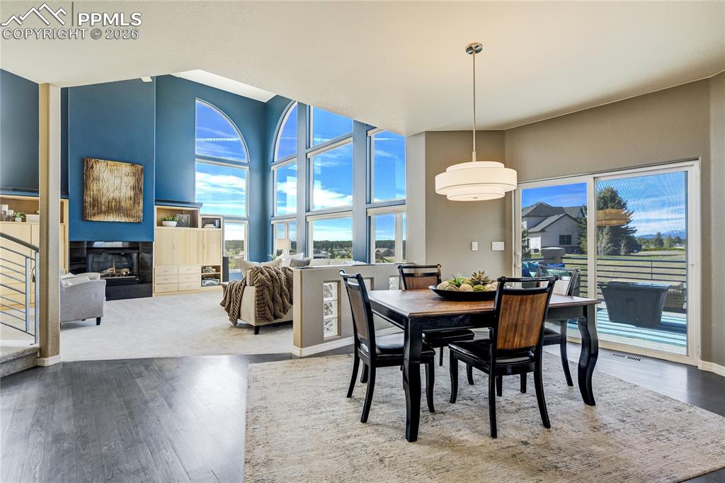 Image 10 of 50: Newer hickory hardwood floors extends throughout the entry, formal dining r